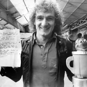 Liverpool Footballer Phil Thompson with the Mickey Mouse Cup and letter presented to him before League Cup final by Everton fan Liverpool Footballer Phil Thompson with the Mickey Mouse Cup and letter presented to him before League Cup final by Everton fan