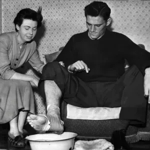 Manchester City footballer Bill Leivers with foot in bowl of water, Print Manchester City footballer Bill Leivers with foot in bowl of water, Print