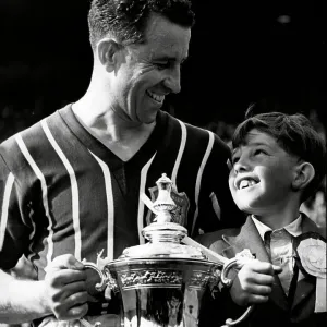 Manchester City Footballer Roy Paul after FA cup final with his son Robert 1956 Manchester City Footballer Roy Paul after FA cup final with his son Robert 1956