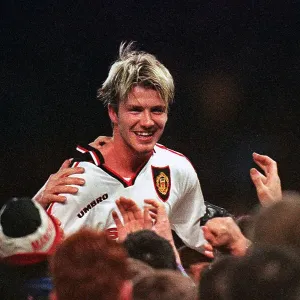 Manchester United's David Beckham is chaired off the Villa Park by fans after their extra-time win against Arsenal, in FA Cup semi-final replay 1999 Manchester United's David Beckham is chaired off the Villa Park by fans after their extra-time win against Arsenal, in FA Cup semi-final replay 1999