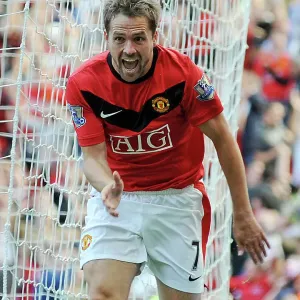 Michael Owen celebrates scoring a goal in Manchester United print Michael Owen celebrates scoring a goal in Manchester United print