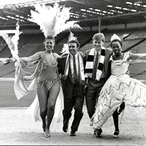 Mirandinha and Neil McDonald of Newcastle United, with samba dancers
