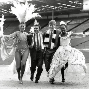 Mirandinha and Neil McDonald of Newcastle United, with samba dancers