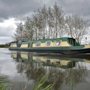 Narrowboats pass along the Bridgewater Canal Narrowboats pass along the Bridgewater Canal