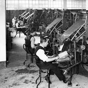 Newspaper linotypers at work