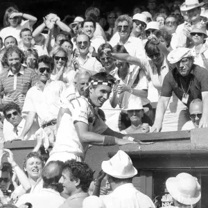 Pat Cash climbs into the crowd to greet his family Pat Cash climbs into the crowd to greet his family