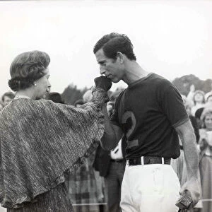 Prince Charles kisses the Queens hand at a polo match 1984