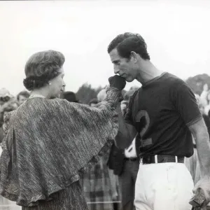 Prince Charles kisses the Queens hand at a polo match 1984