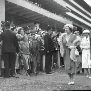 Queen Elizabeth, the Queen Mother, Princess Margaret and the Earl of Rosebery, one of the Jockey Club stewards, walk to the paddock before the start of the Derby 1956