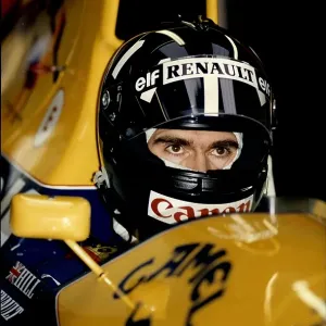Racing driver, Damon Hill, sitting his Formula 1 car at Silverstone 1993 Racing driver, Damon Hill, sitting his Formula 1 car at Silverstone 1993