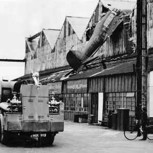 An RAF Avro Anson aircraft crashes into a hangar at Croydon Aerodrome 1949