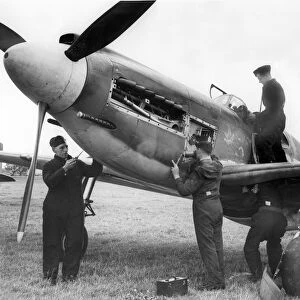 RAF mechanics working on an American Mustang aircraft