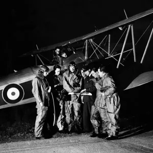 RAF Pilots look at their maps before taking off at Biggin Hill on exercises