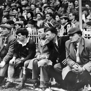 Rugby International 1961. Injured Cyril Davies sits on the touchline bench as Wales battle to victory Rugby International 1961. Injured Cyril Davies sits on the touchline bench as Wales battle to victory