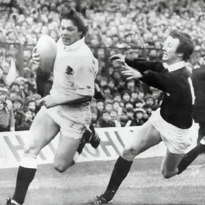 Scotland v England at Murrayfield. John Carleton of England evades Keith Robertson to score Scotland v England at Murrayfield. John Carleton of England evades Keith Robertson to score