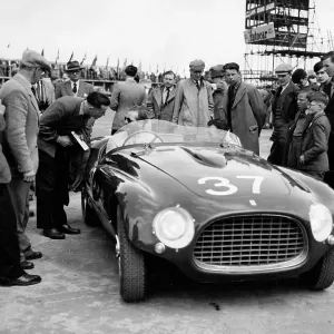 Spectators look at the Ferrari of T.L.H. Cole in the Production Sports Car Race at Silverstone 1953 Spectators look at the Ferrari of T.L.H. Cole in the Production Sports Car Race at Silverstone 1953