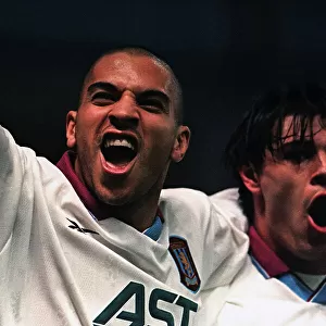 Stan Collymore and Savid Milosevic celebrate scoring in the UEFA cup against Bucharest