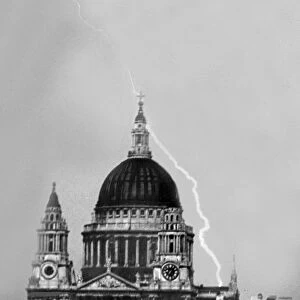 Storm over St Pauls Cathedral in London, a bolt of lightning just misses
