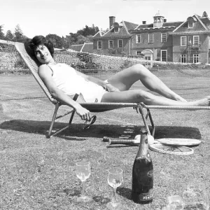 Tennis Player Virginia Wade relaxing in the sun at home in Kent after her Wimbledon win 1977 Tennis Player Virginia Wade relaxing in the sun at home in Kent after her Wimbledon win 1977