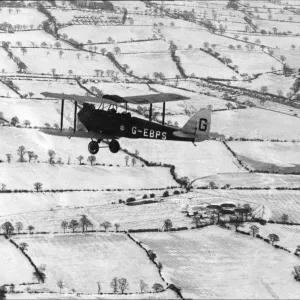 Aerial Print of Tiger Moth Over Snow