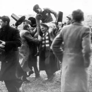 Wales rugby fans chairing the Welsh full back Terry Davis from the pitch after a 5 nations match 1953 Wales rugby fans chairing the Welsh full back Terry Davis from the pitch after a 5 nations match 1953
