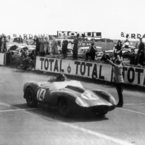 The winning Ferrari crosses the line during the 1958 Le Mans 24 Hours Race The winning Ferrari crosses the line during the 1958 Le Mans 24 Hours Race