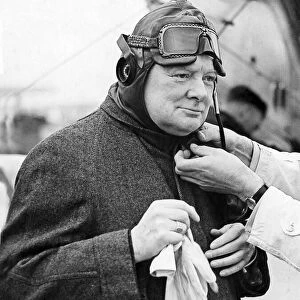 Winston Churchill trying on a flying helmet