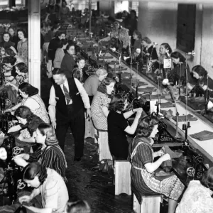 Women sewing army uniforms 1939 Women sewing army uniforms 1939