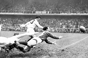 Ireland Prints: Andy Mulligan (dark shirt) passes the ball in the Ireland v England (0-3)