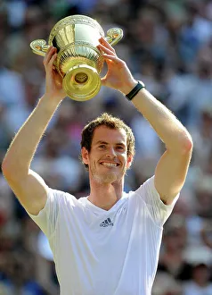 Archive Prints: Andy Murray holds the trophy aloft after he wins the Wimbledon Championship in 2013