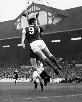 Pictures Prints: Arsenal's David Court and Spurs goalkeeper Bill Brown fight for the ball 1962