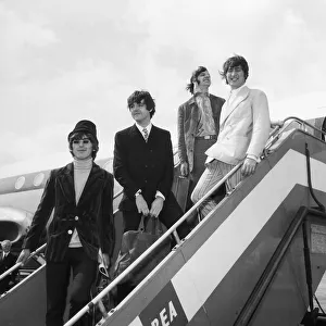 The Beatles at London Airport to fly out to Germany for a brief