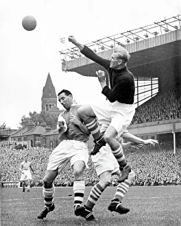 Pictures Prints: Bert Trautmann, Manchester City Goalkeeper clears the ball from Tommy Lawton of Arsenal