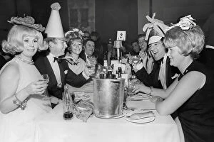 Famous Faces Collection: Bobby Moore, and wife Tina Moore across the table from Terry Venables