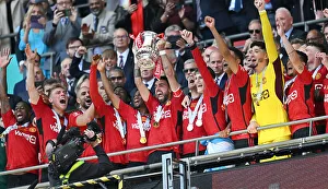 Archive Prints: Bruno Fernandes lifts the trophy as the Man United Team Celebrate