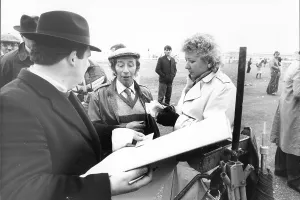 Horse Racing Prints: Cheltenham racecourse: Bookmaker Len da Costa from Birmingham pays out to a lucky punter