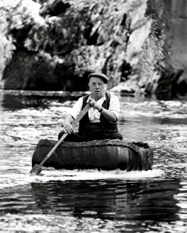 Boats Prints: Coracle fisherman on the River Teifi