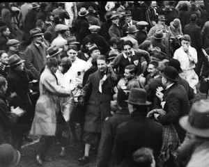 The crowd carry PT Murray to the pavillion after and Ireland win against England 1930