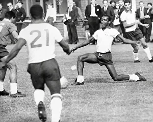 Denilson passes the ball to Pele during Brazilian football team training session for the 1966 World Cup