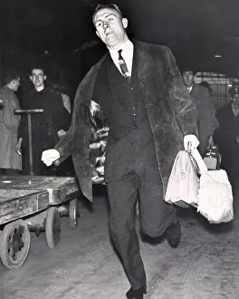 England Football Team Prints: Don Howe rushing to catch a train at Paddington after being told he is playing with the England team 1963