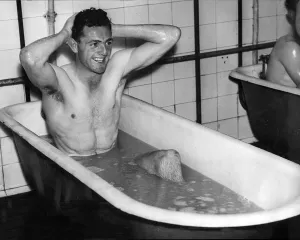 Manchester City FC Prints: Eddie McMorran, Manchester City footballer taking a bath after training