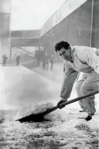 Christmas Football Prints: Emilio Aldecoa Birmingham City trainer clearing snow from pitch
