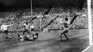 England Prints: England v Brazil 1956 First goal Tommy Taylor gives goalkeeper Gilmar no chance