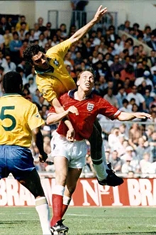 England's David Platt under pressure from Brazil's Ricardo II