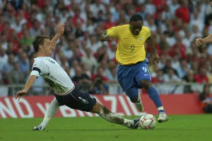 England Prints: England's John Terry and Vagner Love of Brazil