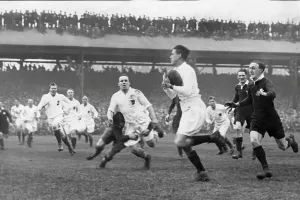 Archive Prints: England's Roger Spong tackled as he passed the ball to Jim Reeve who went on to score
