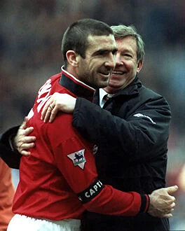 Images Dated 14th September 2023: Eric Cantona hugging Manchester Utd manager Alex Ferguson