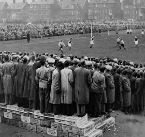 Football Grounds And Crowd Prints: Fans standing on boxes to watch the FA Cup Tie at Great Yarmouth FC football ground 1953