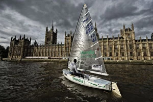 Colour pictures Collection: Finn class dinghy on the Thames by the Houses of Parliament