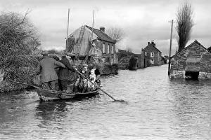 Archive Prints: Flood in Athenley, Somerset, with a boat floating down main street, 1929